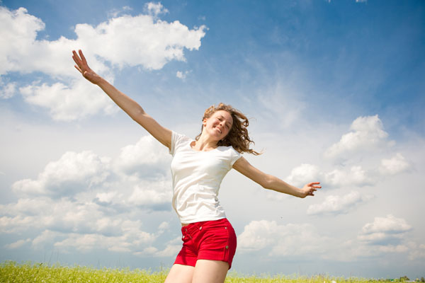 bigstock Happy young woman jumping 16414802